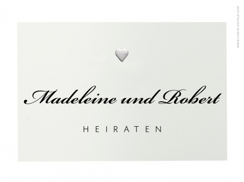 Schlichte, hochwertige Hochzeitseinladung mit Blindprägung, gedruckt auf Büttenpapier, eleganter Typografie und Umschlag mit grünem Seidenpapier.
